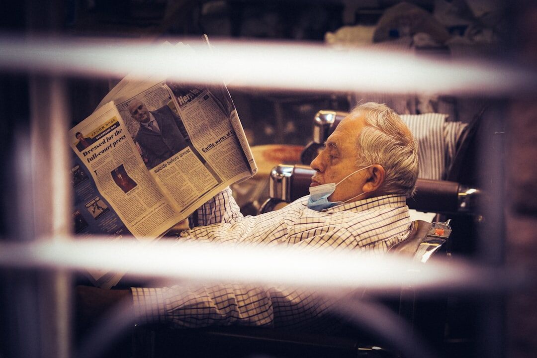 senior reading newspaper