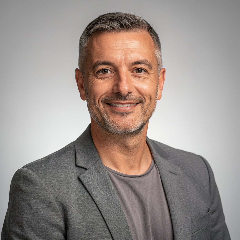 Croatian man event organizer smiling in casual professional attire