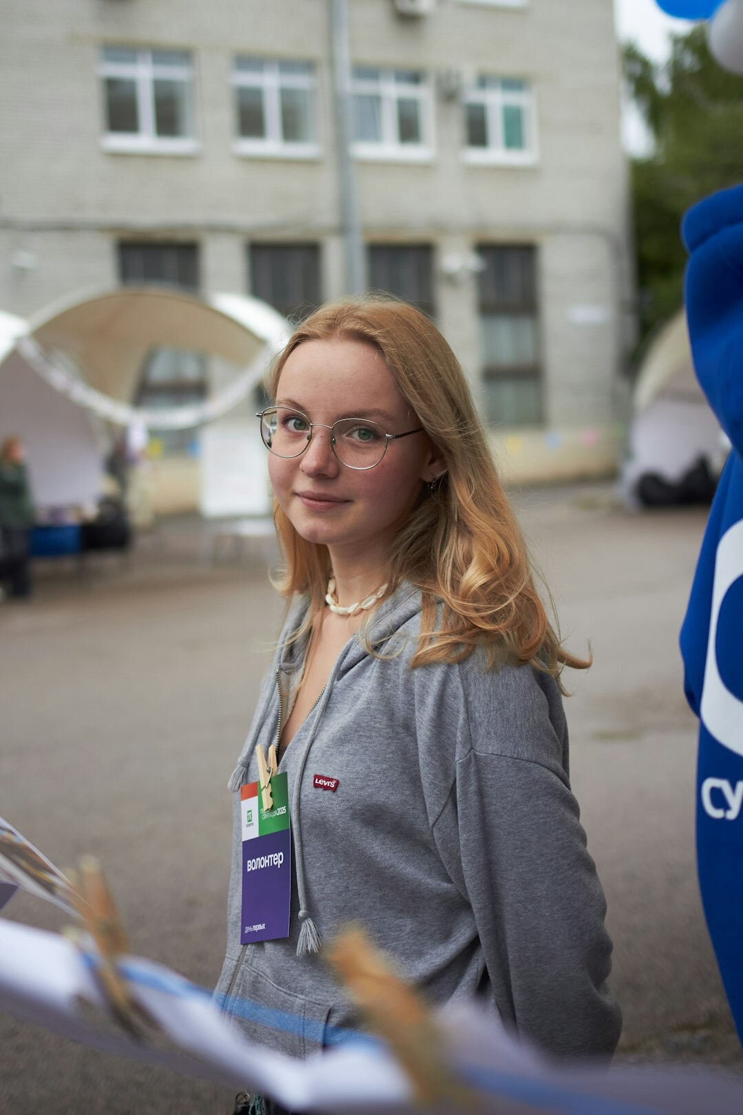 Croatian woman activity coordinator smiling in casual professional attire