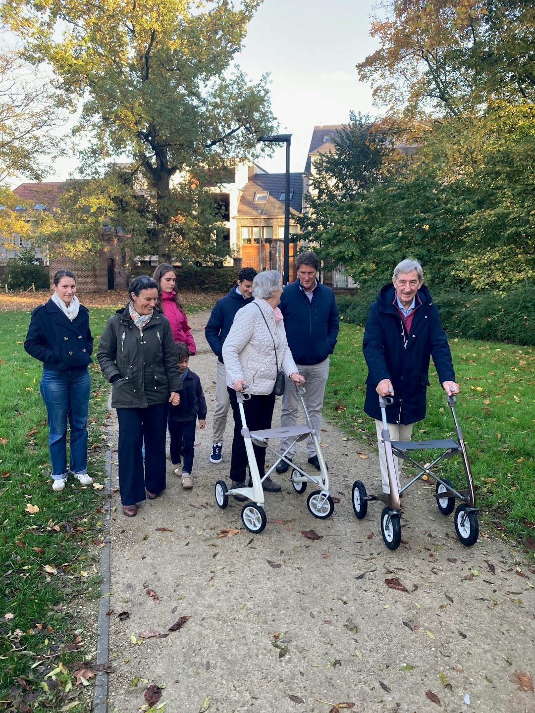 elderly couple walking in park