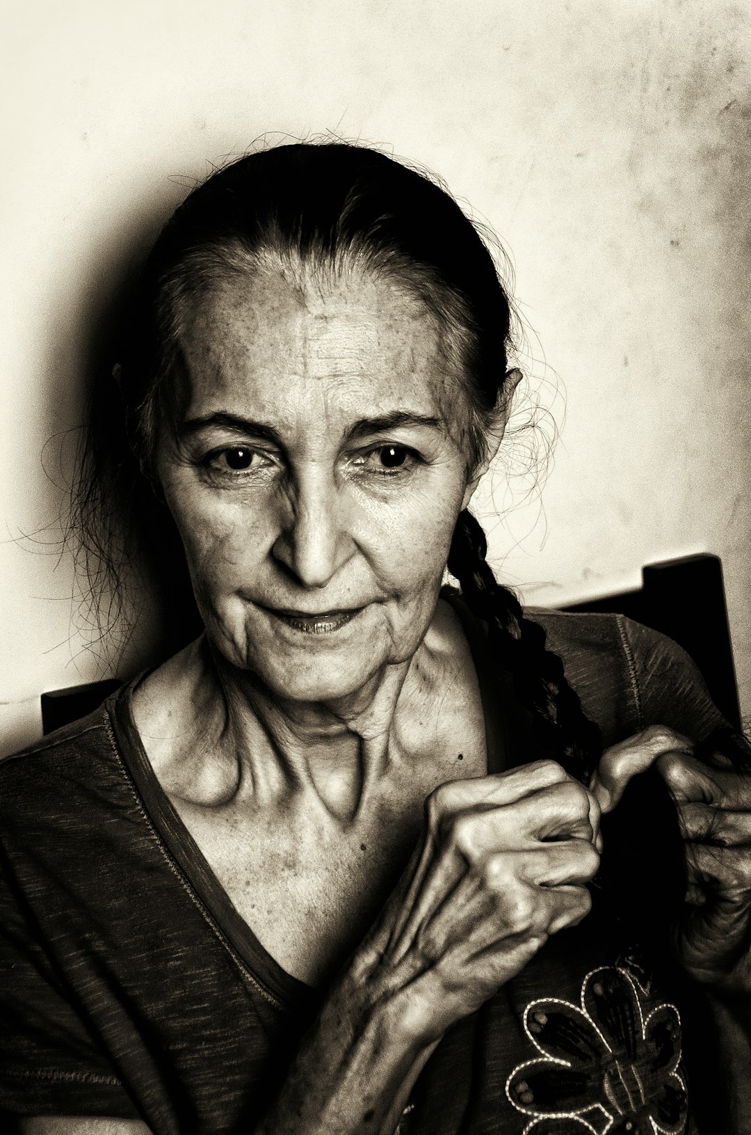 elderly woman knitting